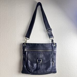 Fossil Crossbody bag in soft Black leather and brass hardware .
